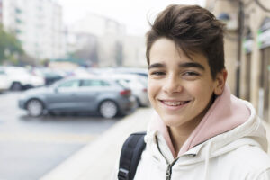 portrait of young teenager on city street
