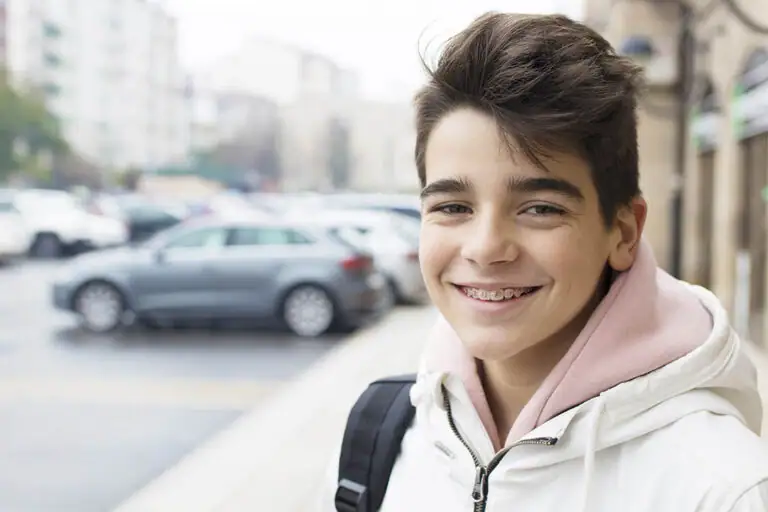 Teen with braces smiling outdoors in Cranford NJ